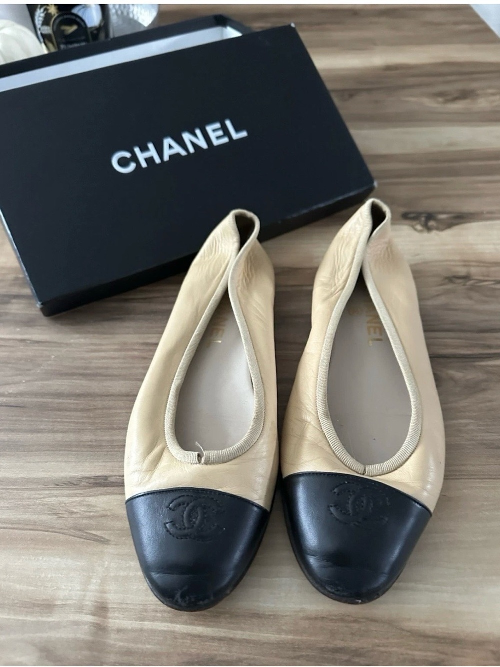 CHANEL Beige Leather Ballet Flats with Black Cap Toe